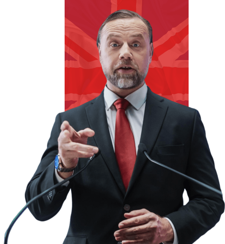 man-stands-podium-with-flag